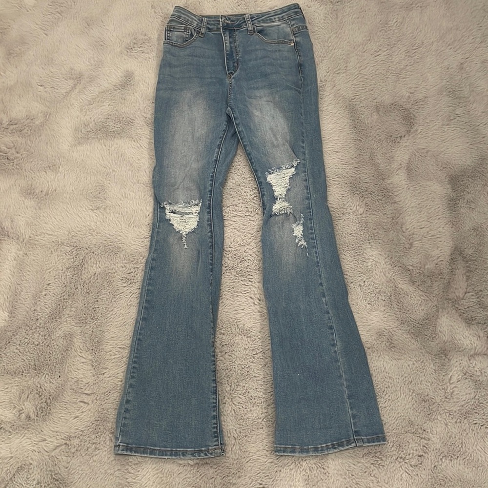 Ripped jeans with flare on bottom.